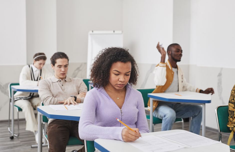 Students working through a practice test in a classroom